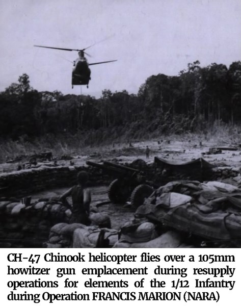 Photo of a CH-47 Chinook helicopter flies over a 105mm howitzer gun emplacement during resupply operations for elements of the 1/12 Infantry during Operation FRANCIS MARION (NARA)